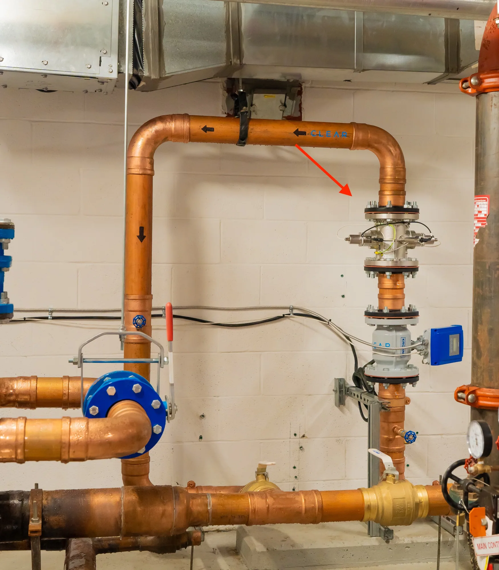 The RS104 HOD UV reactor at The Ellington, installed vertically on a new 4-inch copper line in the pump room