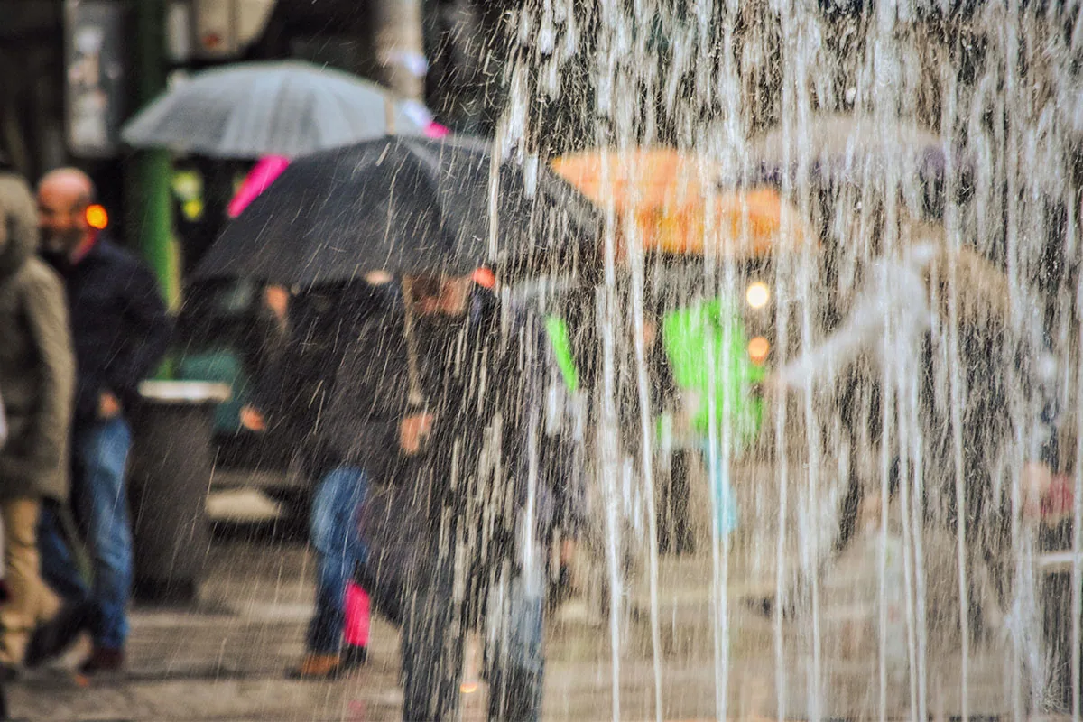 Heavy rain falling on standing water